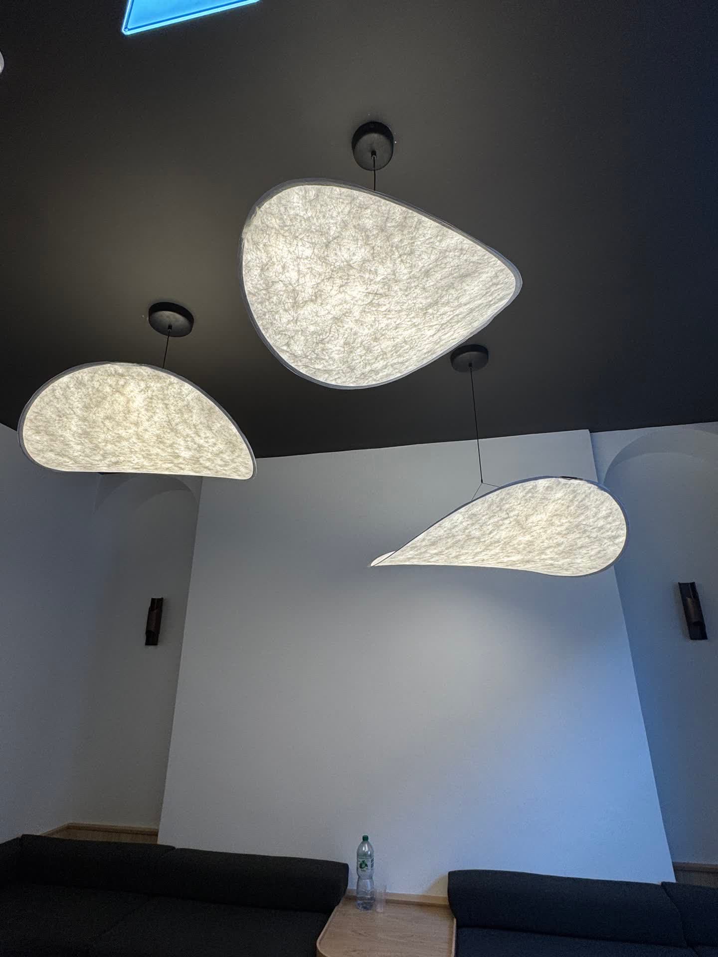 Designer teardrop wall sconces installed along a dark feature wall in Harcourt Dental Clinic corridor, Dublin 2